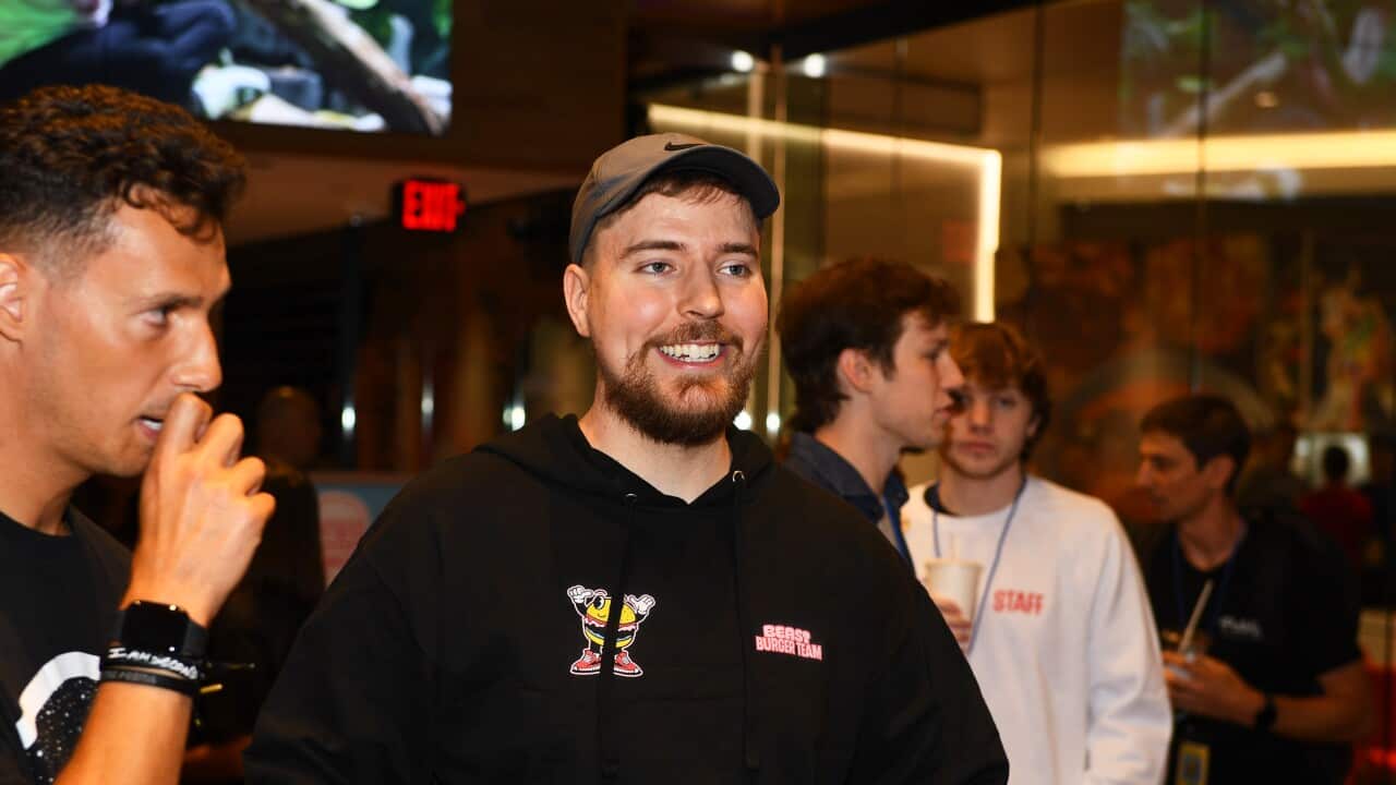 A man in a cap and a hoodie.