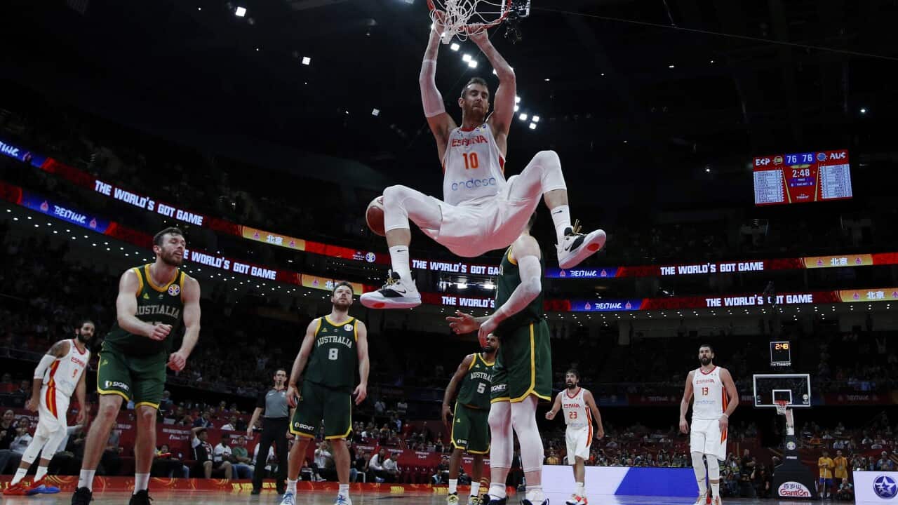 Victor Claver of Spain dunks the ball against Australia during their semifinals match for the FIBA Basketball World Cup at the Cadillac Arena in Beijing, Saturday, Sept. 13, 2019. (AP Photo/Andy Wong, Pool)