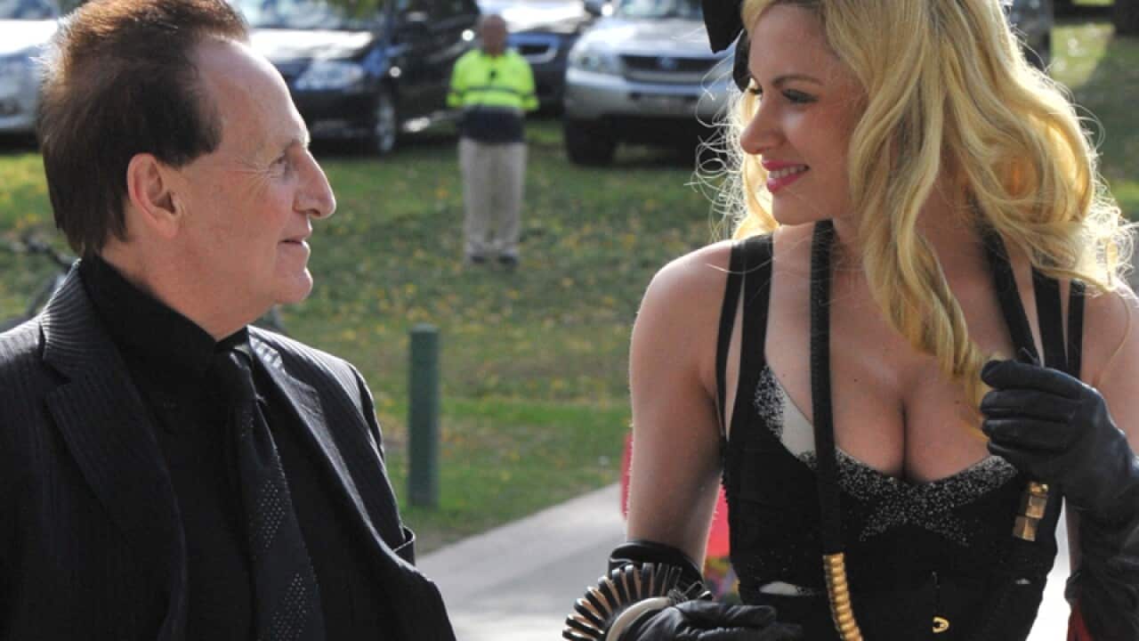 Geoffrey Edelsten and Gabi Grecko (R) at Tom Hafey's funeral.
