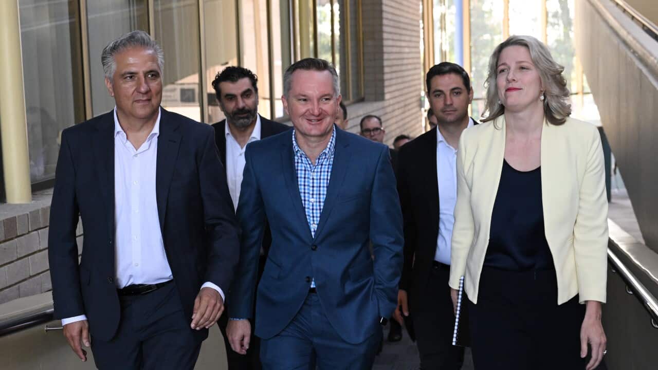 A small group of people walking outside