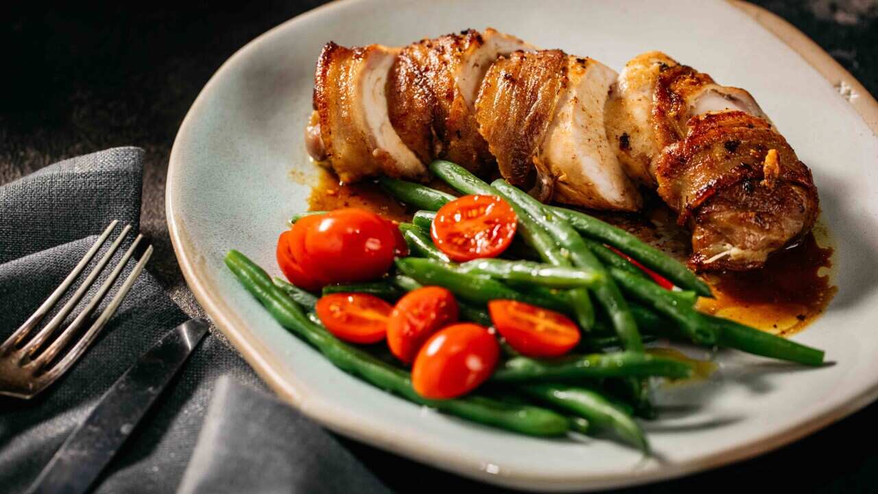 Chicken wrapped in bacon with goats cheese