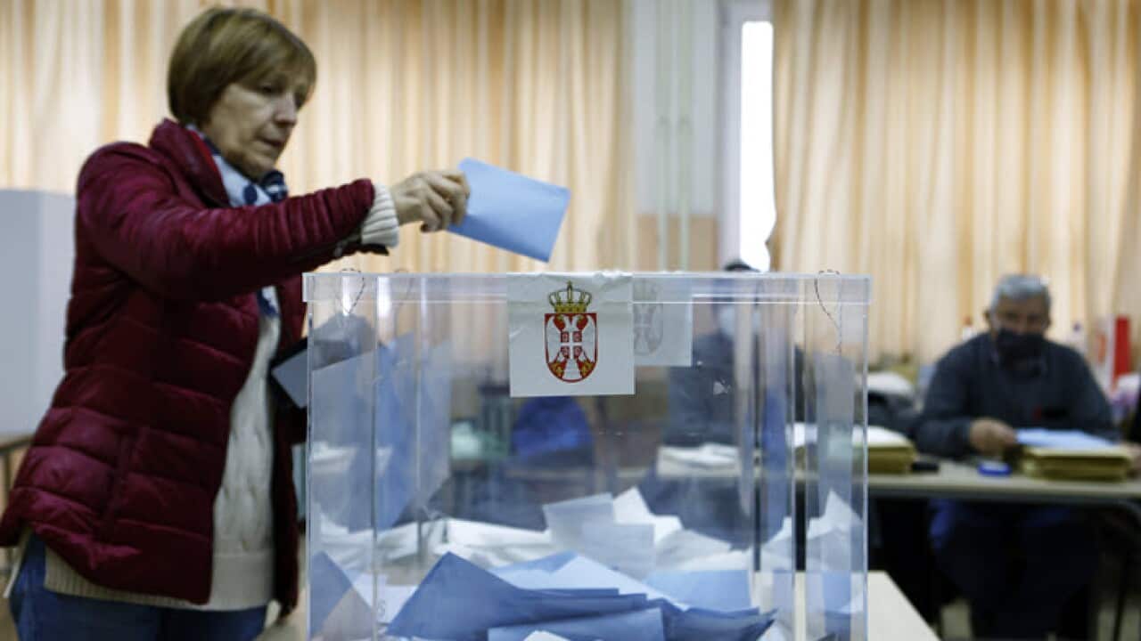 SERBIA ELECTIONS 03/04/2022 07:37 epa09867269 A woman casts her ballot during the general elections in Belgrade, Serbia, 03 April 2022. Voters in Serbia are voting for the members or Parliament, the President and the municipal deputies. EPA/MARKO DJOKOV