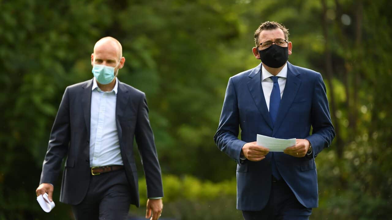 Victorian Premier Daniel Andrews (right) arrives to a press conference in Melbourne, Thursday, February 4, 2021