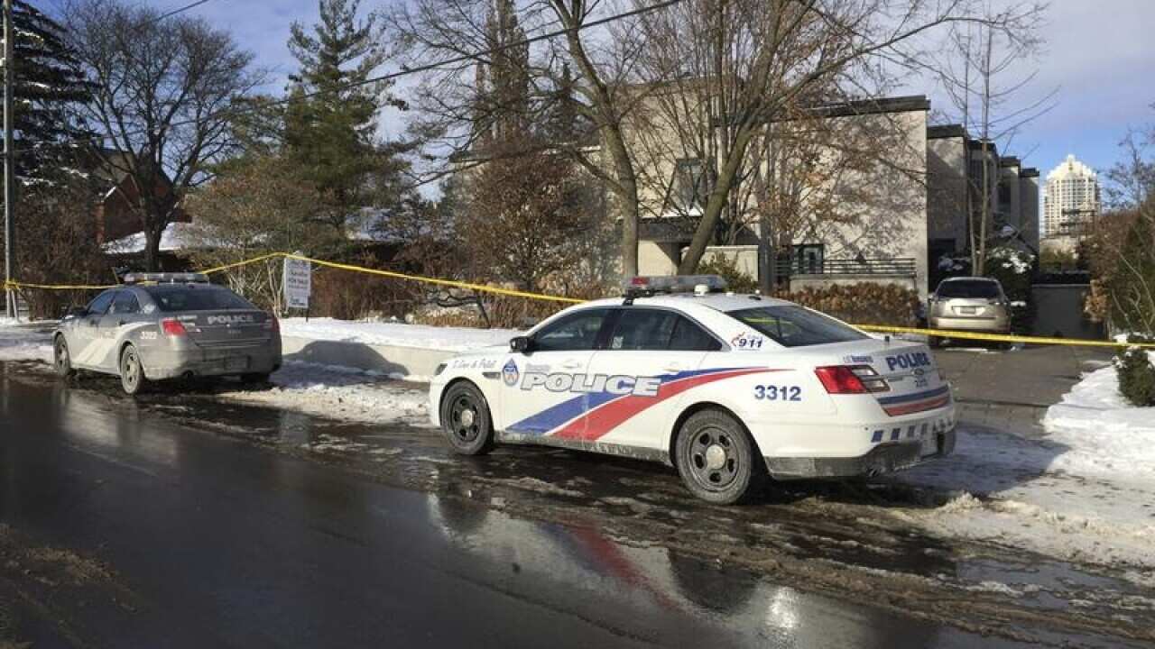 Police at the home of Canadian billionaire Barry Sherman and his wife who were found dead.