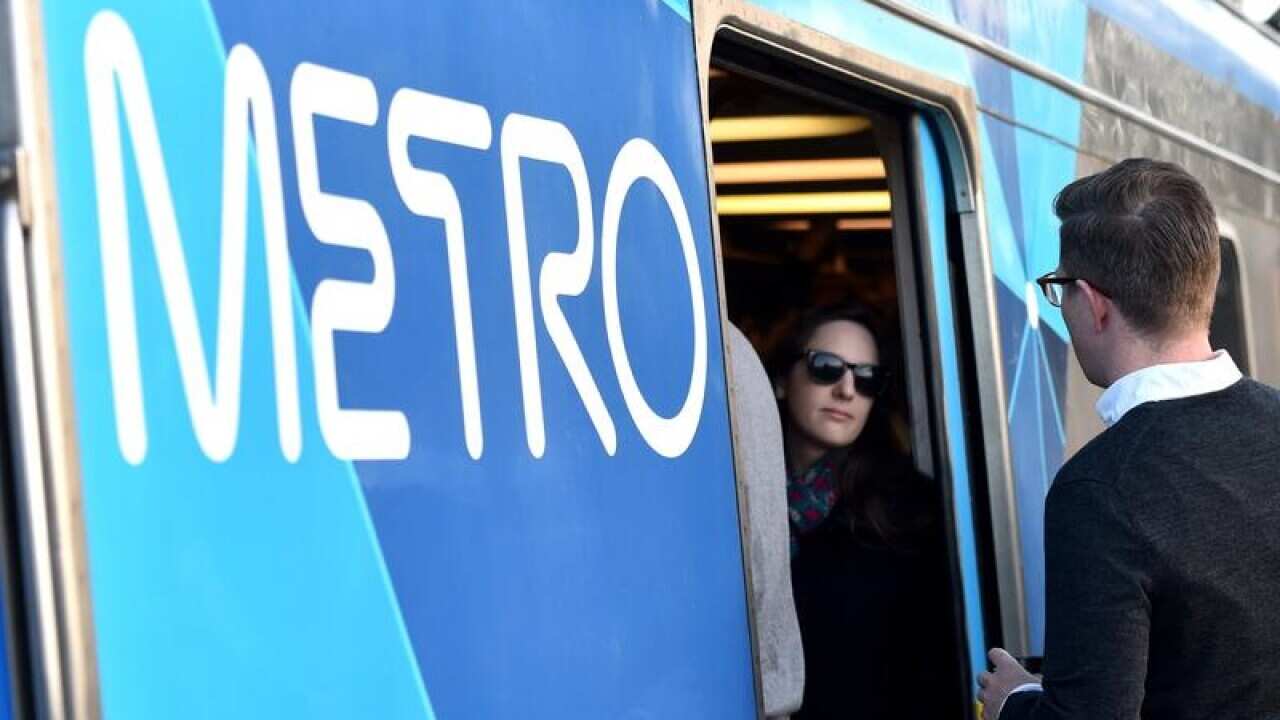 Peak hour commuters cram into a city loop train