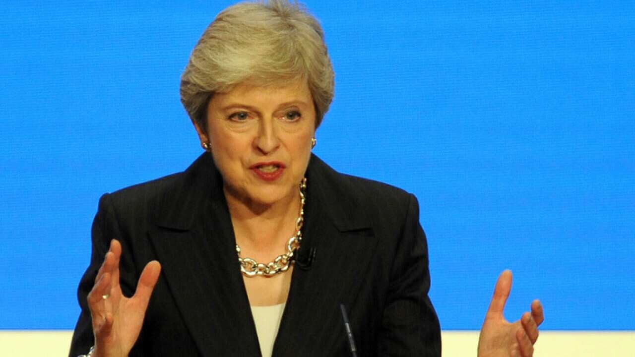 Conservative Party Leader and Prime Minister Theresa May addresses delegates during a speech at the Conservative Party Conference at the ICC, in Birmingham, England, Wednesday, Oct. 3 , 2018. (AP Photo/Rui Vieira)