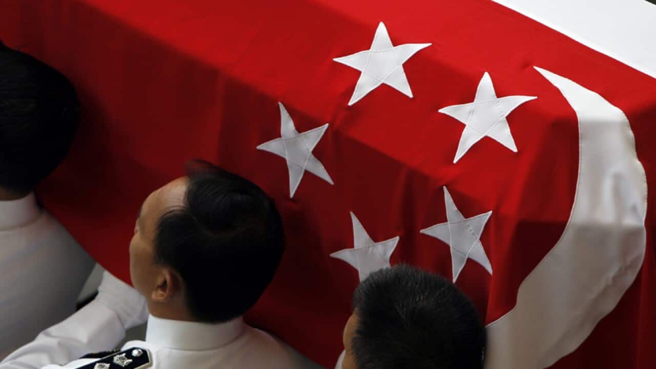 Pallbearers carry the flag draped coffin of the late Mr Lee Kuan Yew