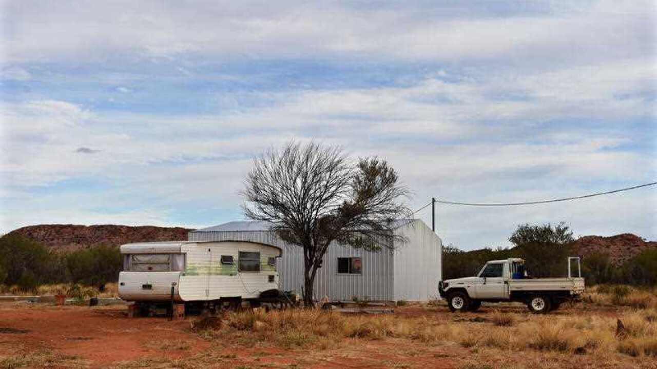 A shed used as a house and caravan is pictured on an outstation near Alice Springs, Thursday, May 28, 2015