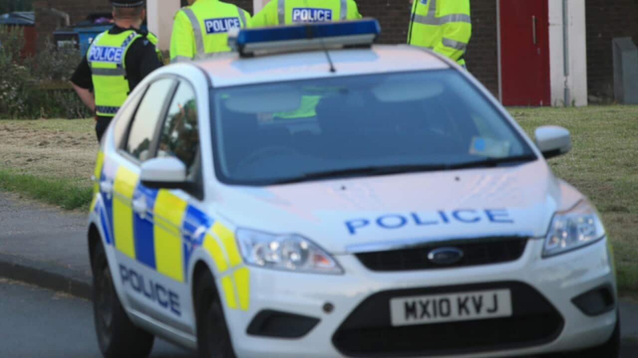 Police outside a block of flats