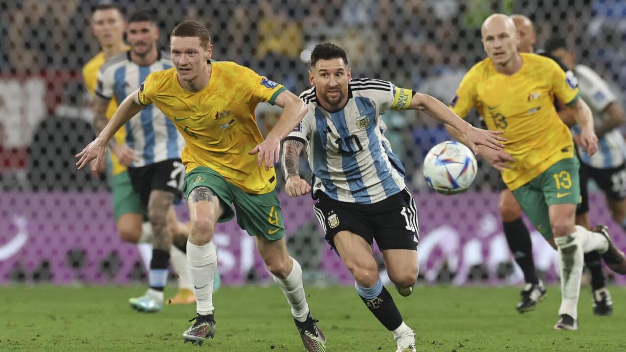 Lionel Messi of Argentina vies with Kye Rowles of Australia during the FIFA World Cup Qatar 2022 Round of 16 match.