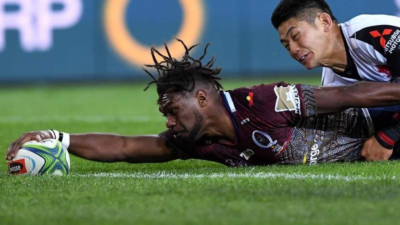 Moses Sorovi of the Reds scores a try against the Sunwolves.
