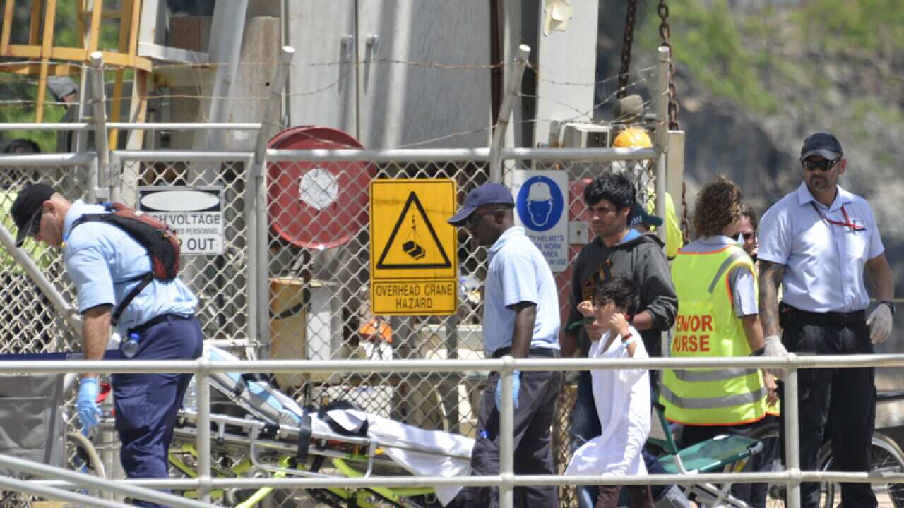 Two dead after wave capsizes asylum boat