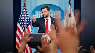 JD Vance points to reporters amongst raised hands at the White House press room.