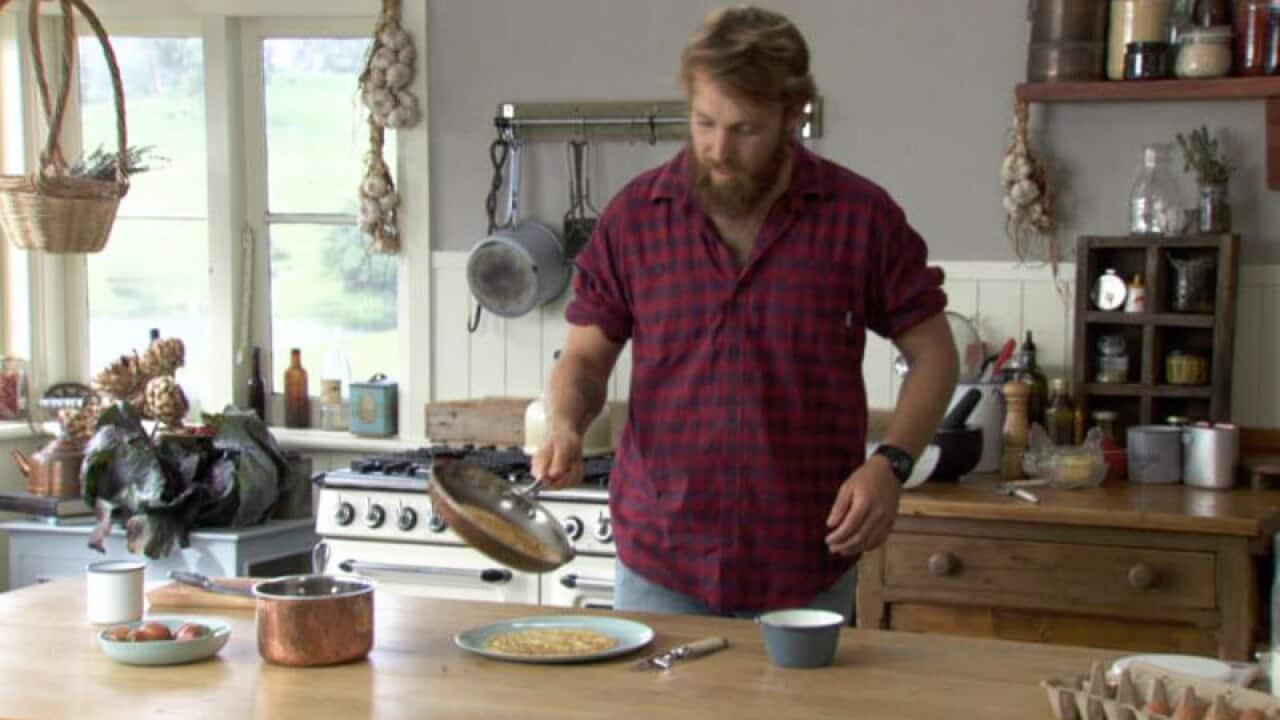 Paul West cooks pancakes