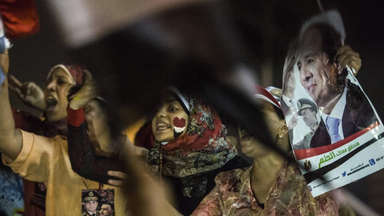 Egyptians celebrate in Cairo's after Abdel Fattah al-Sisi won the vote
