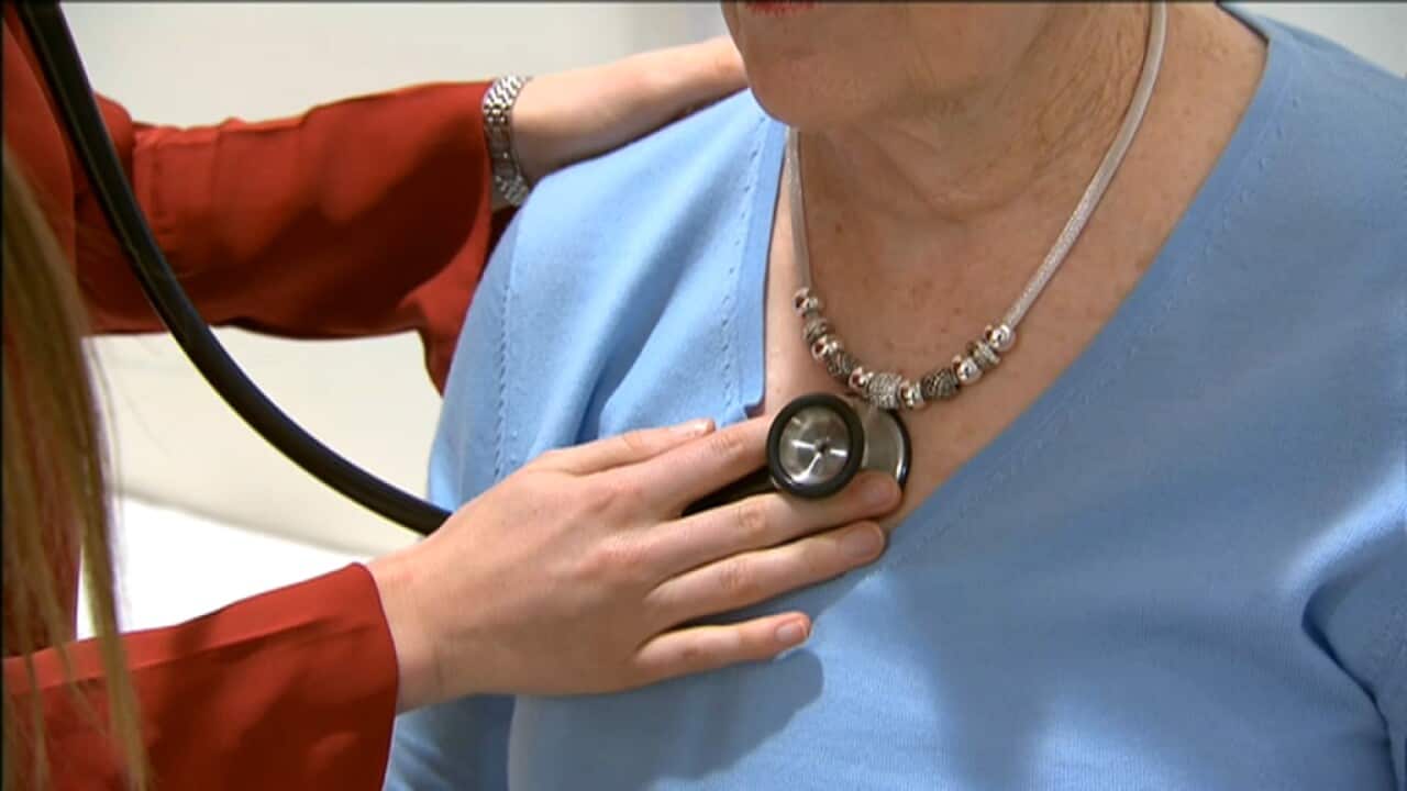 A doctor conducts a heart health check on a patient