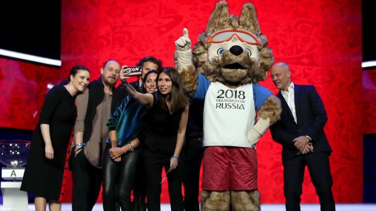 World Cup draw co/host Maria Komandnaya takes a selfie with the "Behind the Scenes" guests and World Cup 2018 Mascot Zabivaka at The Kremlin in Moscow two days prior to the World Cup 2018 draw this Friday hosted with Gary Lineker .