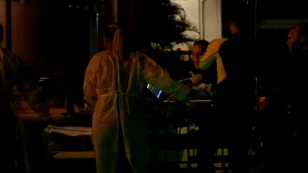 The man being taken to hospital.