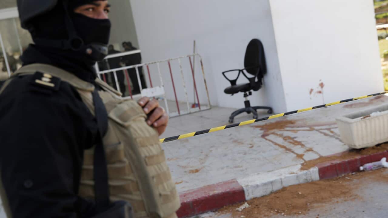 A policeman guards the entrance of the Bardo museum in Tunis