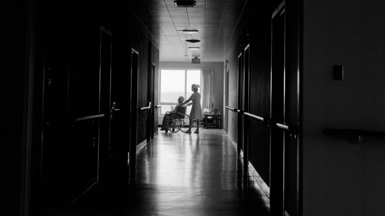 A 1969 photograph of a nurse with a patient
