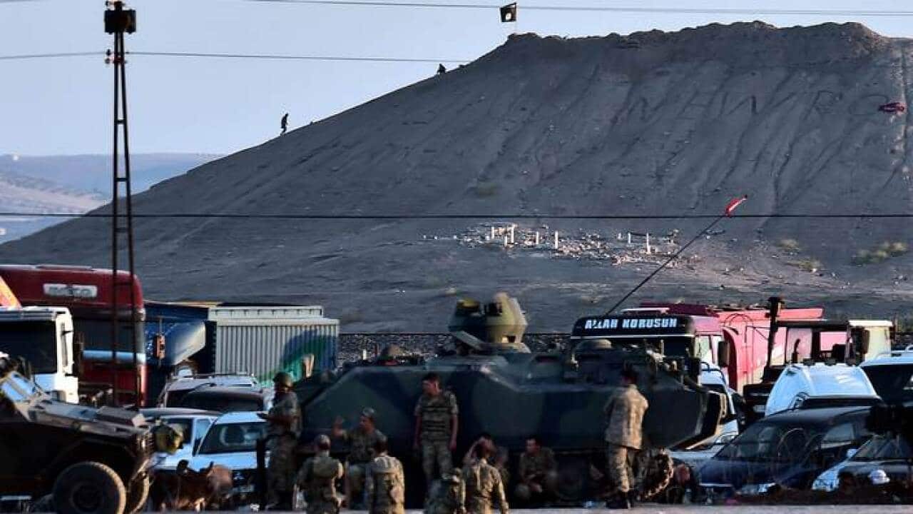 is_flag_flies_across_from_turkey_border_aap_larger.jpg