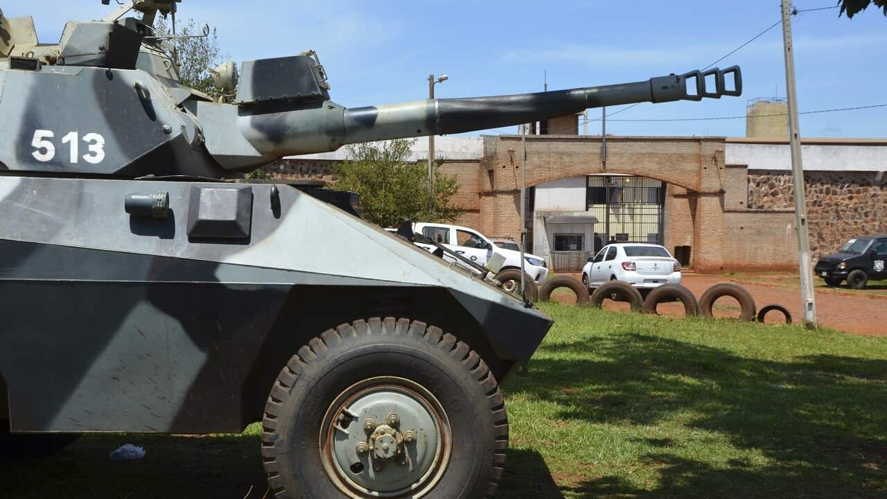 A police tank guards at the Pedro Juan Caballero city jail main entrance.