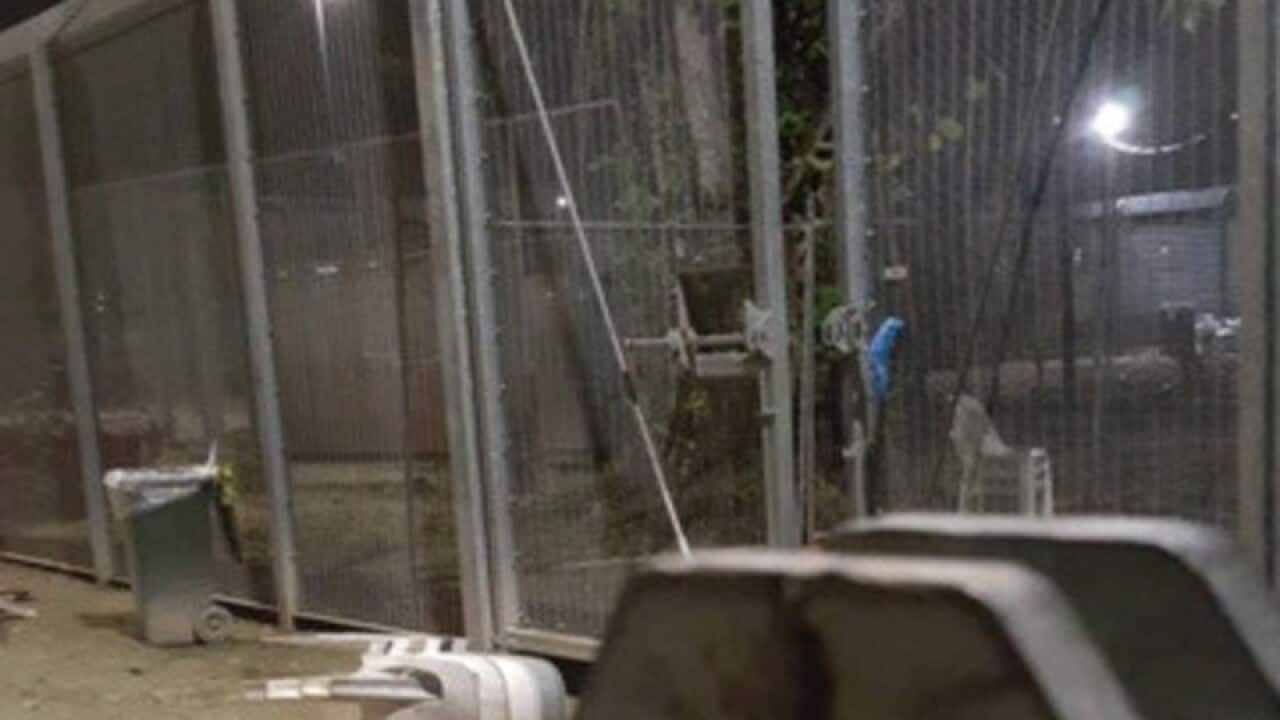 The damaged outer gate to the Oscar Compound on Manus Island detention centre.