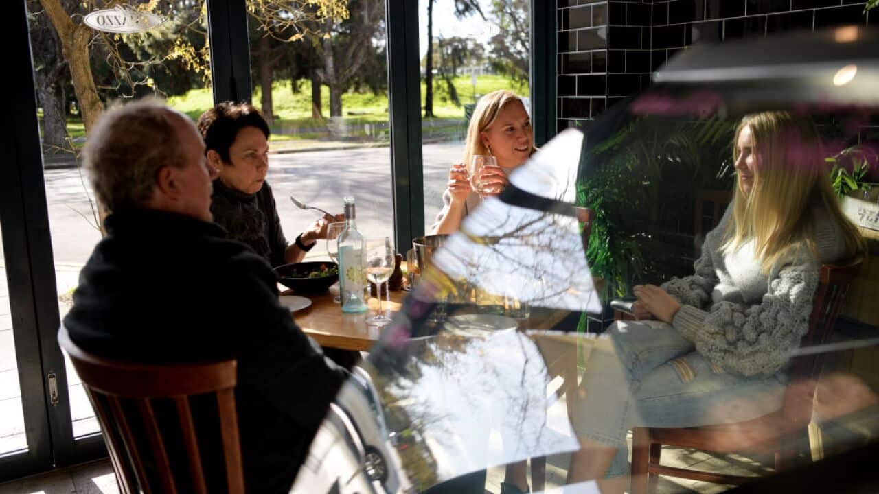 Guests at Cafe Palazzo restaurant enjoy a meal on in Adelaide in June this year.
