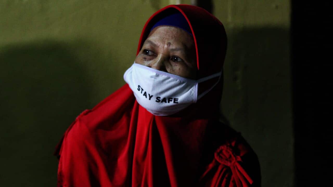 A Woman wearing face masks as a preventive measure, during celebrate Eid in Yogyakarta, Indonesia.