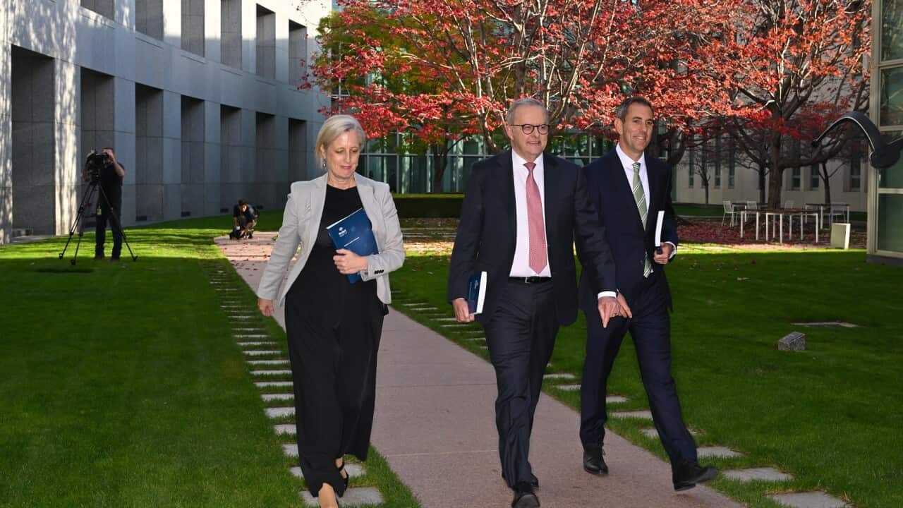 Australian Prime Minister Anthony Albanese, Australian Treasurer Jim Chalmers and Australian Finance Minister Katy Gallagher walk through a courtyard during a pre budget picture opportunity at Parliament House in Canberra.