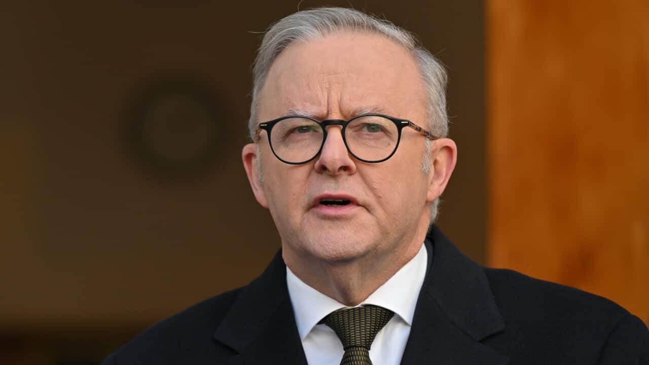 Anthony Albanese speaking outside a building.