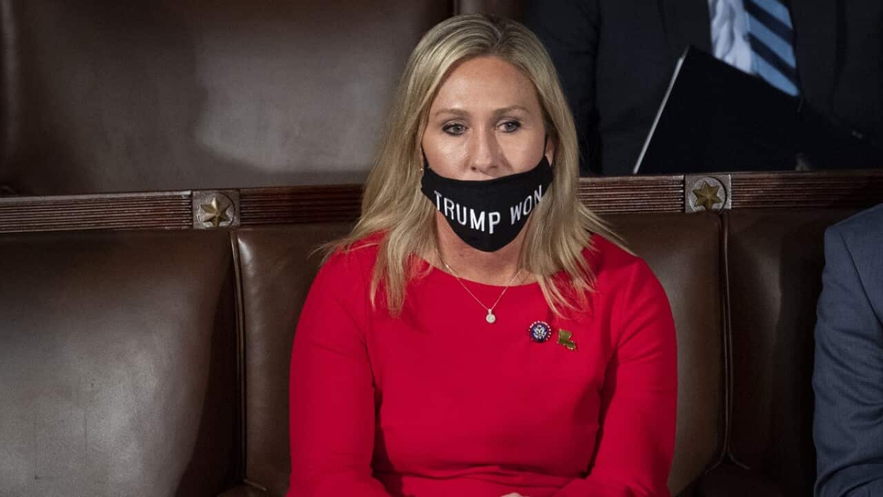 Marjorie Taylor Greene wearing a 'Trump Won' face mask during the first session of the 117th Congress in the House Chamber.
