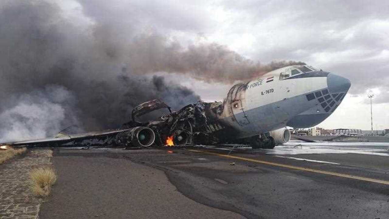 As bombings by the Saudi-led coalition continue on May 4, 2015, a cargo plane is destroyed on a runway at Sanaa International Airport in Yemen. (AAP)