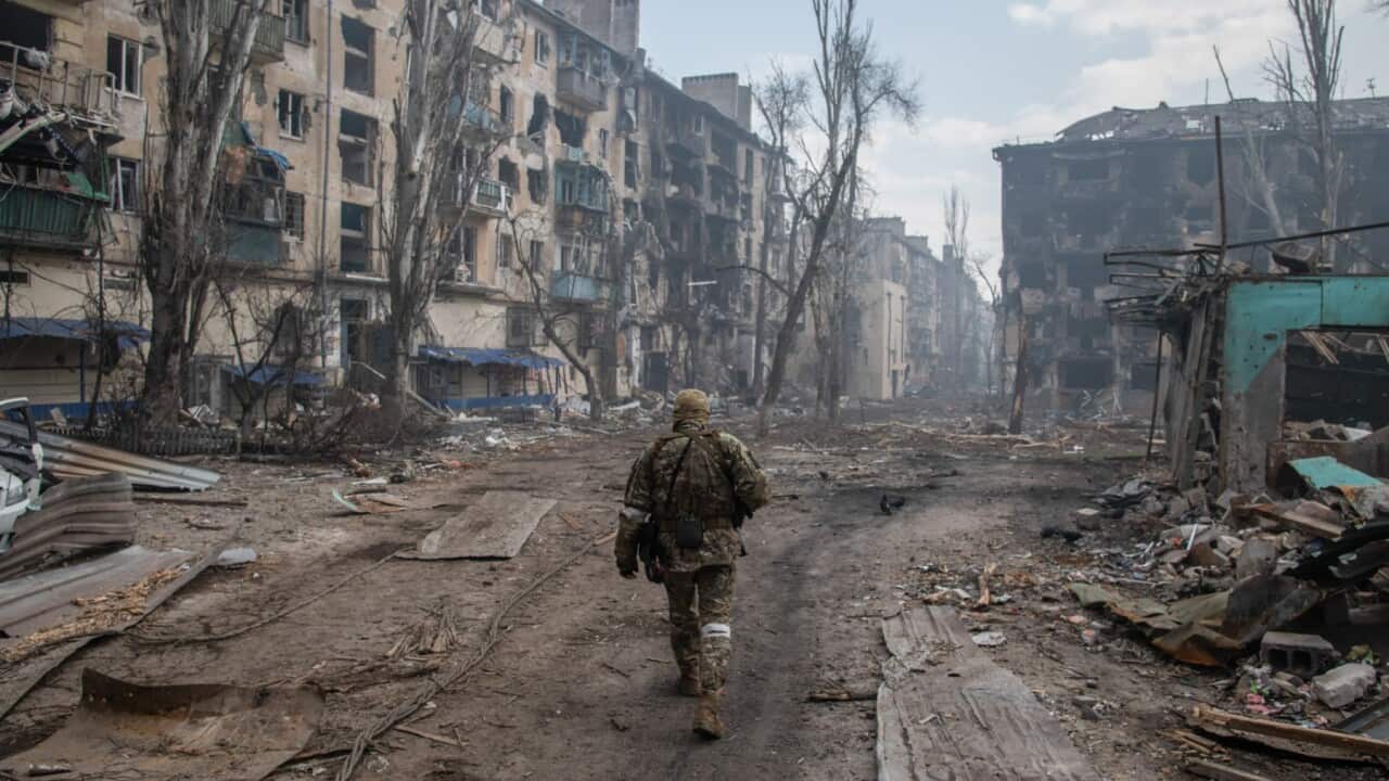 A Russian soldier walks amidst the rubble in Mariupol's eastern side where fierce fighting between Russia/pro-Russia forces and Ukraine continues to rage. / Pro Russian forces and the defending Ukrainian forces led by the Azov b