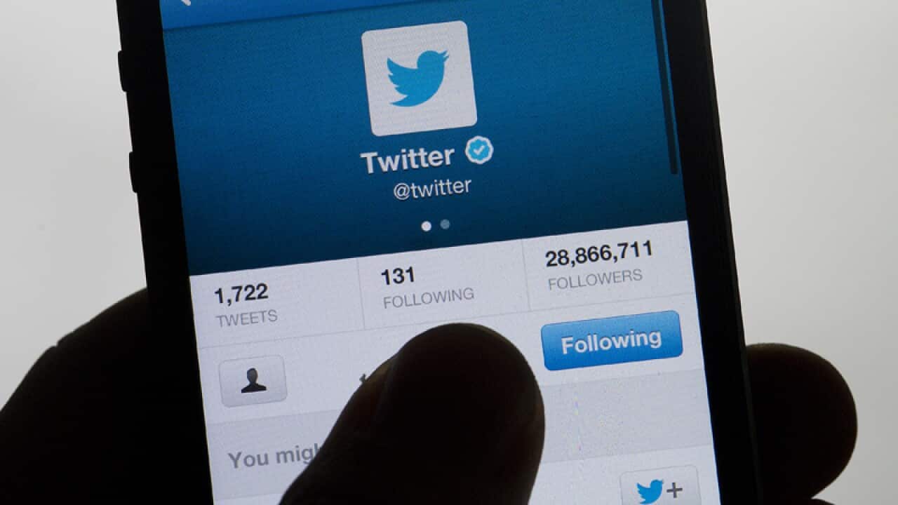 Twitter displayed on a hand held mobile phone