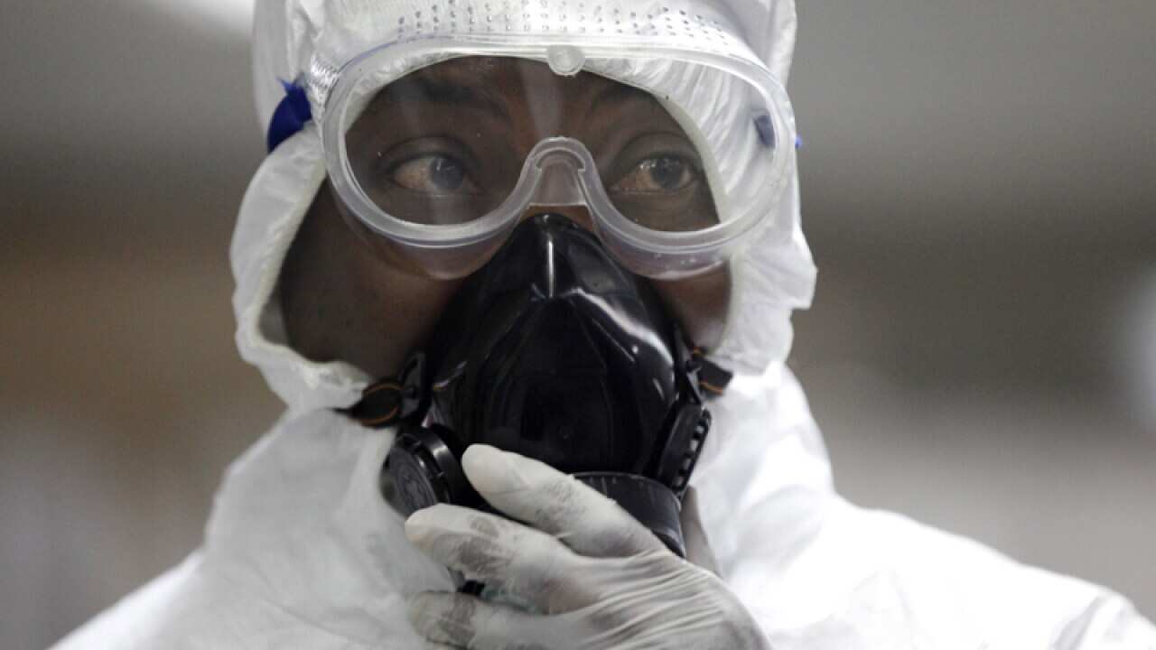 An Ebola healthcare worker in protective clothing.