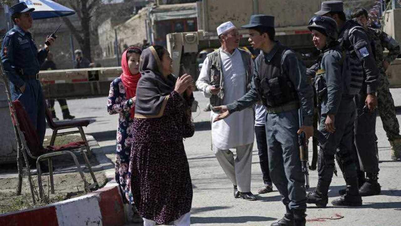 An Afghan woman cries at the site of a deadly suicide bombing near Kabul University, in Kabul, Afghanistan, late last month.
