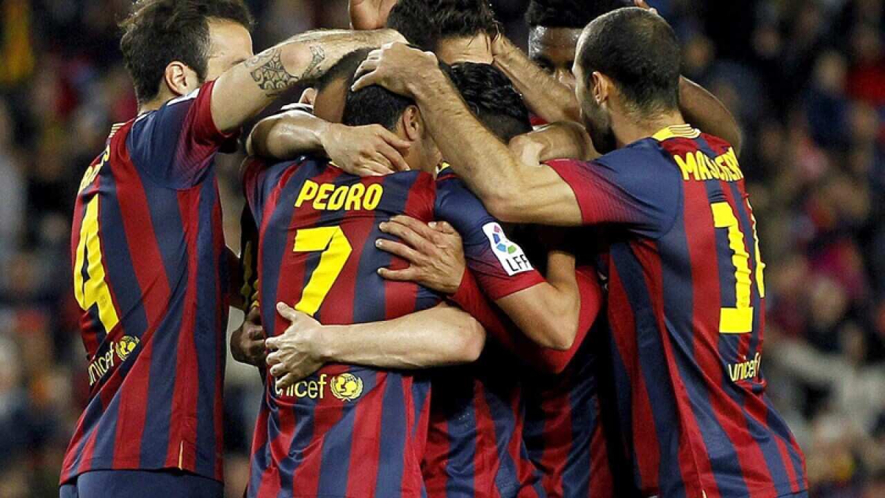 FC Barcelona's players celebrate after Lionel Messi scored a goal