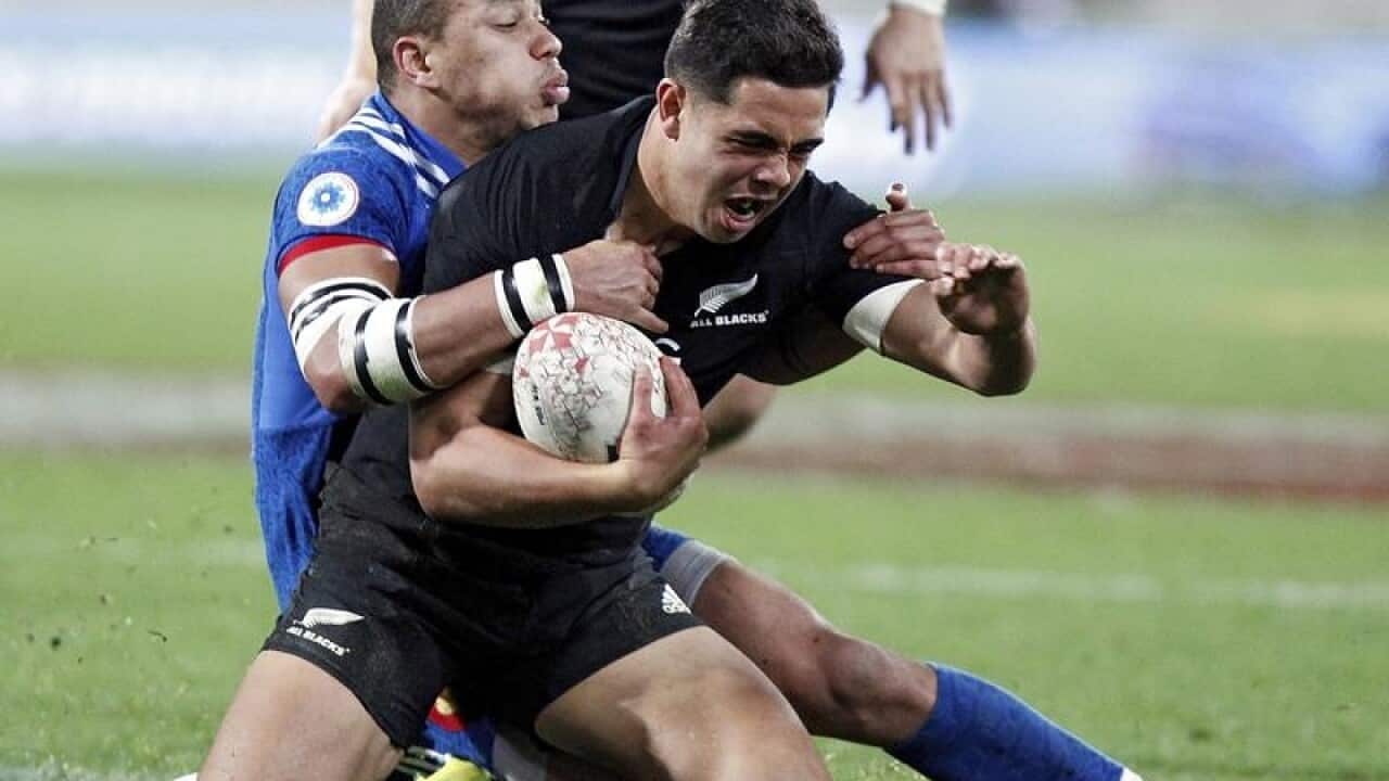 New Zealand's Anton Lienert-Brown is tackled by France's Gael Fickou