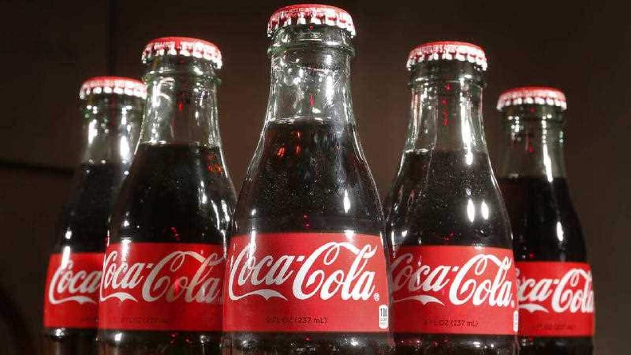 This April 28, 2016, file photo shows bottles of Coca-Cola in Concord, N.H.