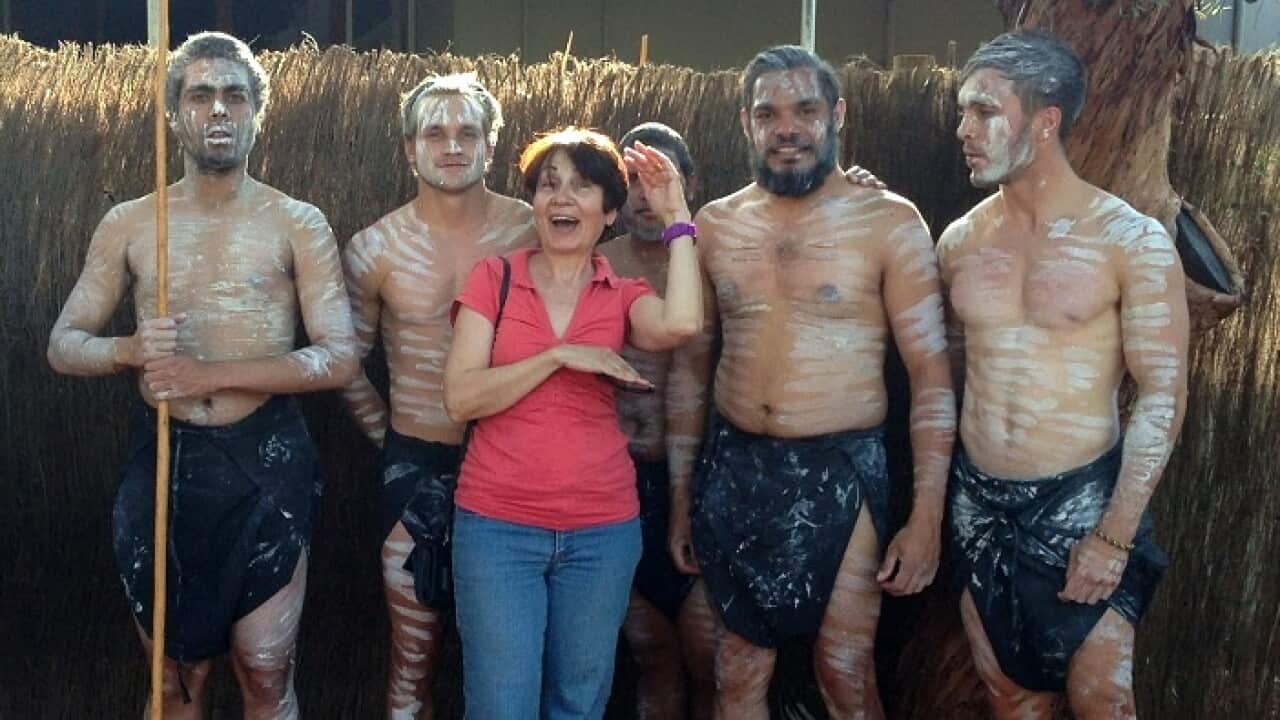 Greek Australian author Vivian Vass with Indigenous dancers in Alice Springs.