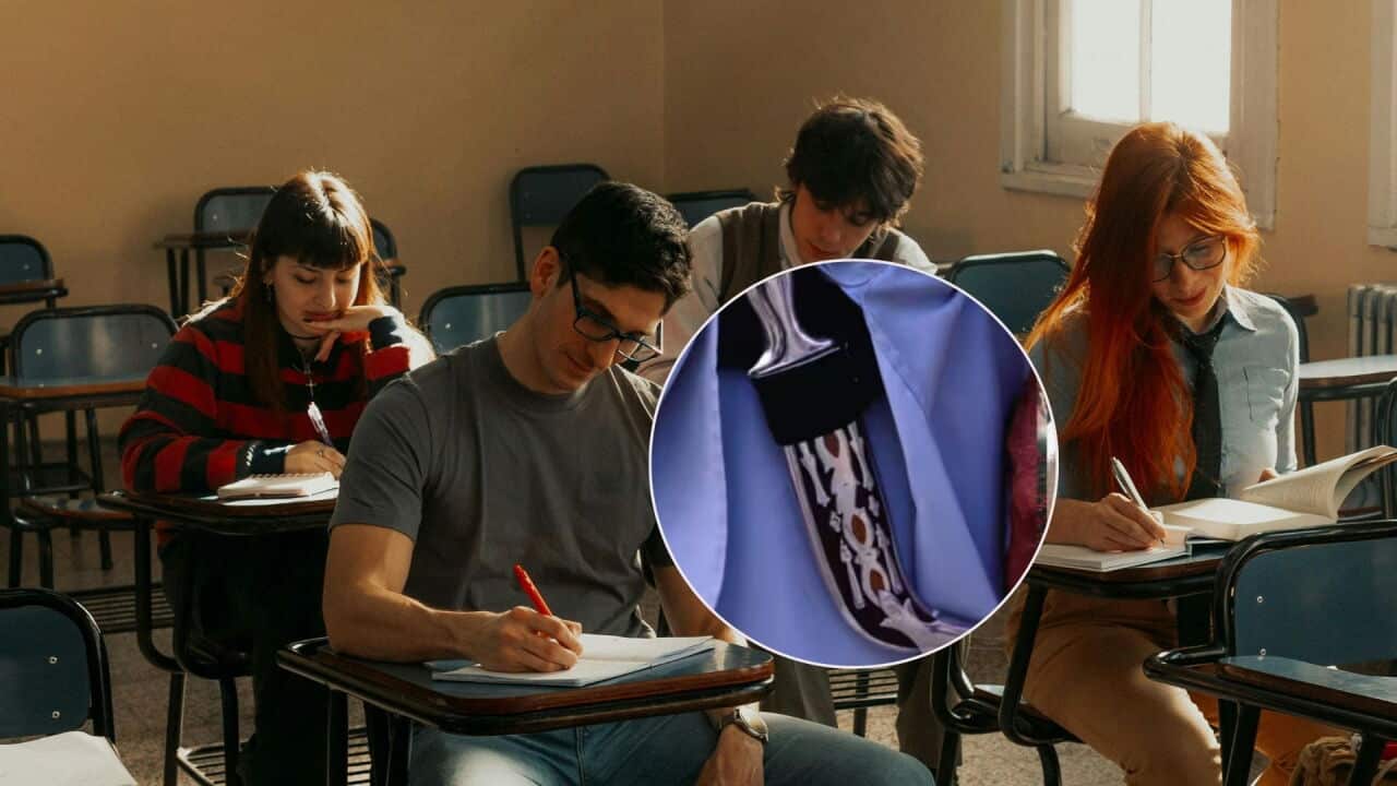 Image of a kirpan superimposed on an image of an exam hall with people sitting and writing on sheets.