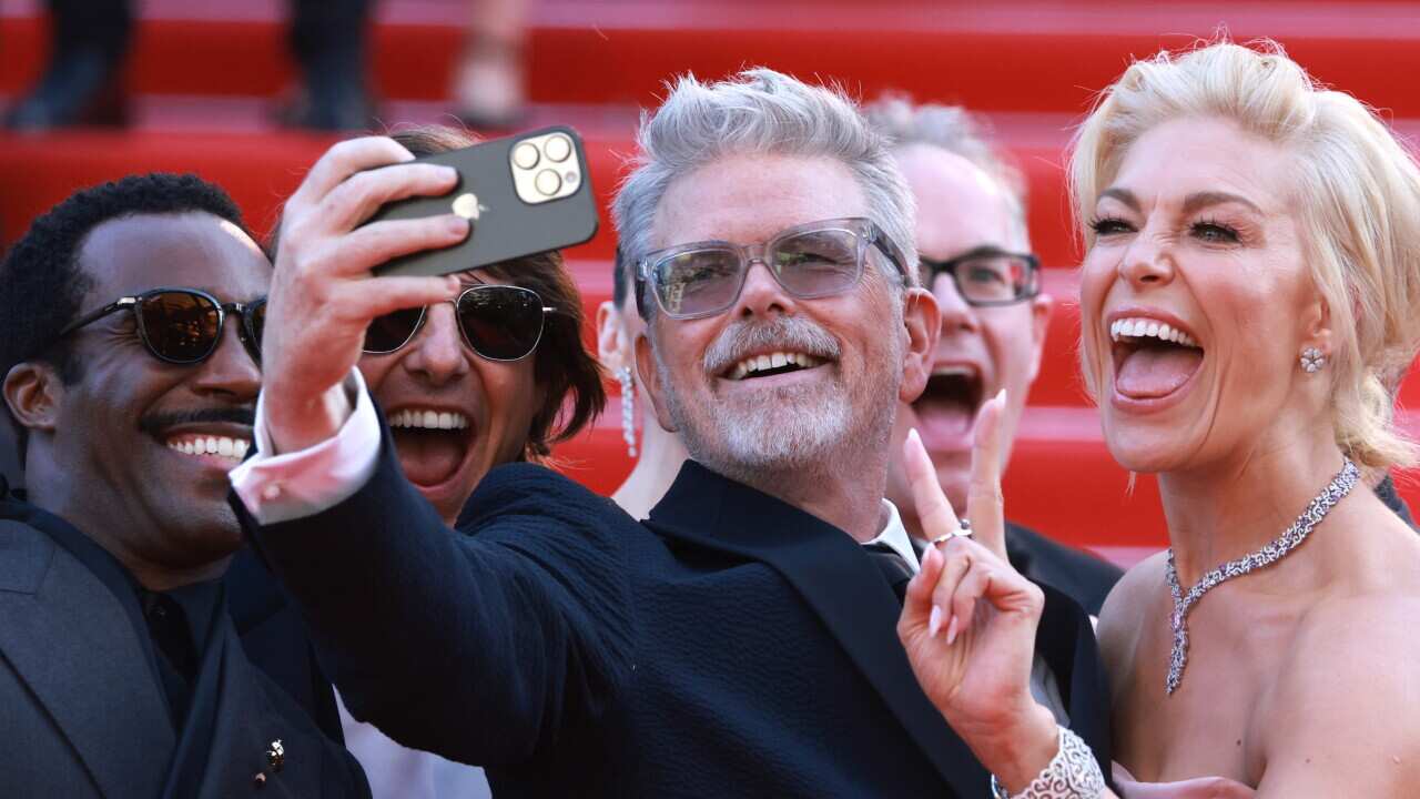Tramell Tillman, Tom Cruise, Christopher McQuarrie, Hannah Waddingham pose for a selfie at the premiere for 'Mission: Impossible - The Final Reckoning' during the 78th annual Cannes Film Festival, in Cannes, France, 14 May 2025.