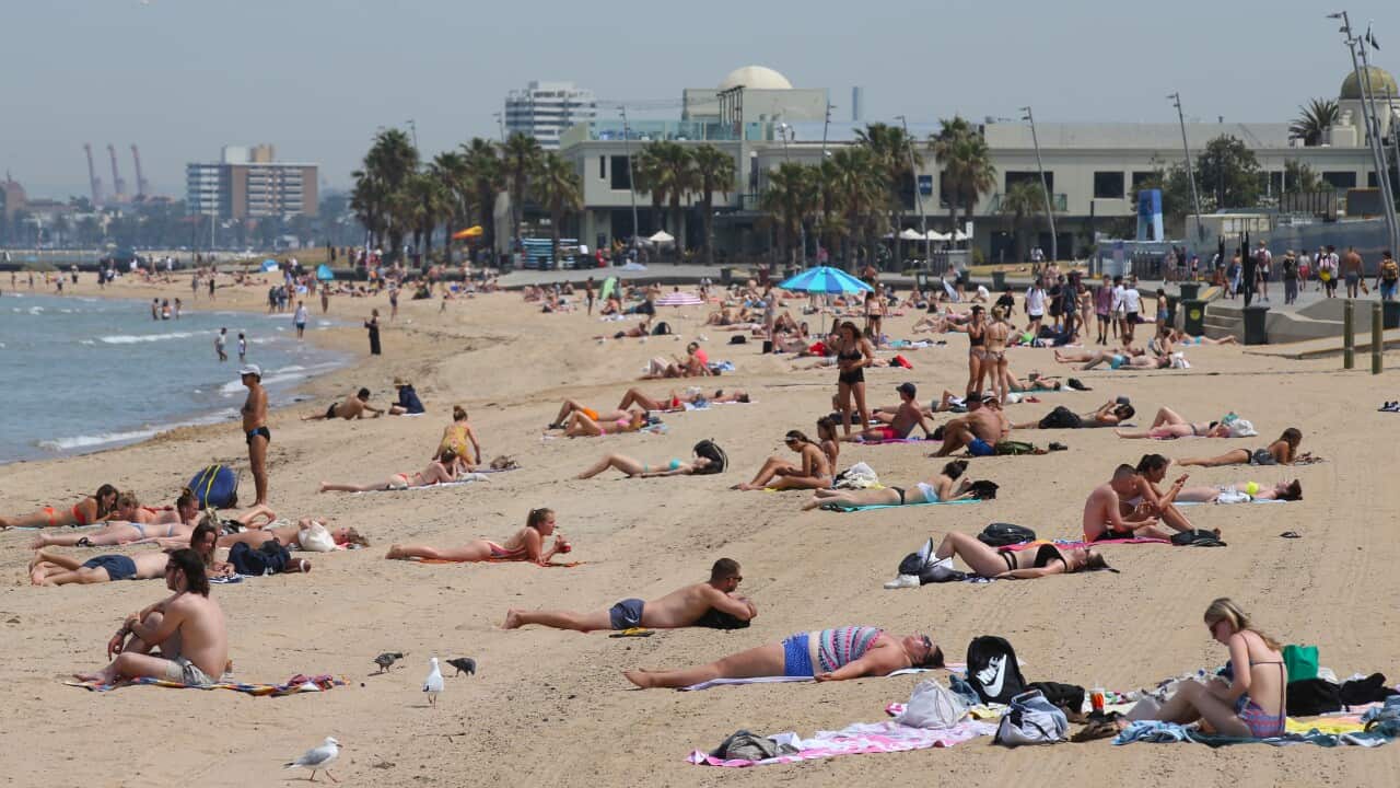 People flock to St Kilda beach as a heat wave sweeps across Victoria. Wednesday, December 18, 2019. (AAP Image/David Crosling) NO ARCHIVING