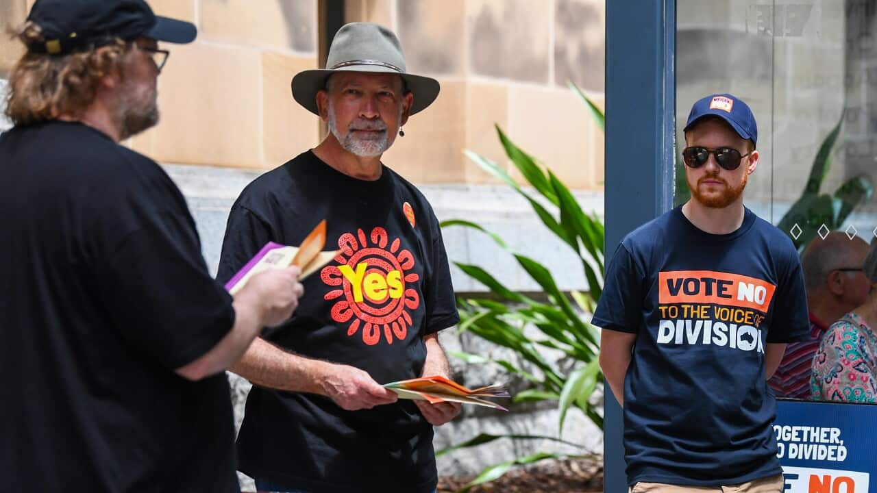 Voters and volunteers are seen at Brisbane City Hall, during early voting for the Indigenous voice to parliament referendum in Brisbane, Tuesday, October 3, 2023.
