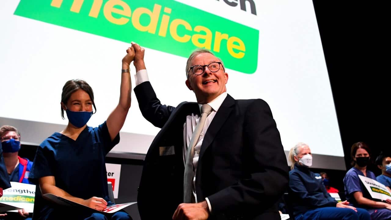 Opposition Leader Anthony Albanese acknowledges a nurse after delivering a speech at the Australian Nursing and Midwifery Federation on Day 3 of the 2022 federal election campaign