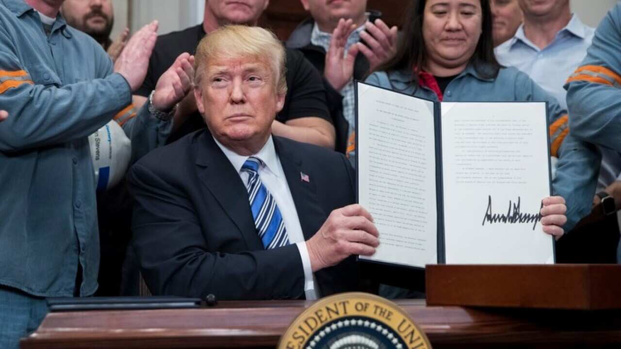 US President Donald J. Trump signs a presidential proclamation on steel tariffs