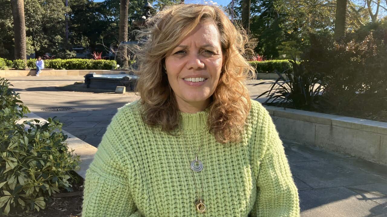 A woman standing in a park