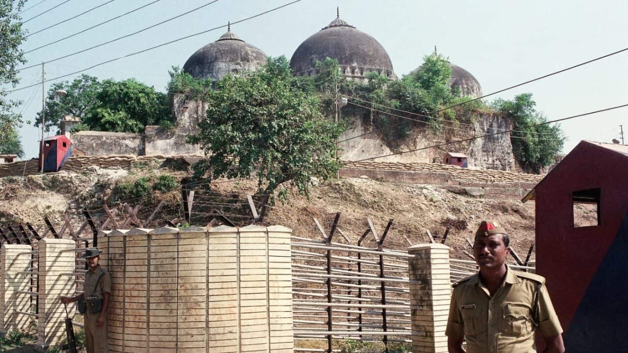 In this Oct. 29, 1990, file photo, Indian security officer guards the Babri Mosque in Ayodhya