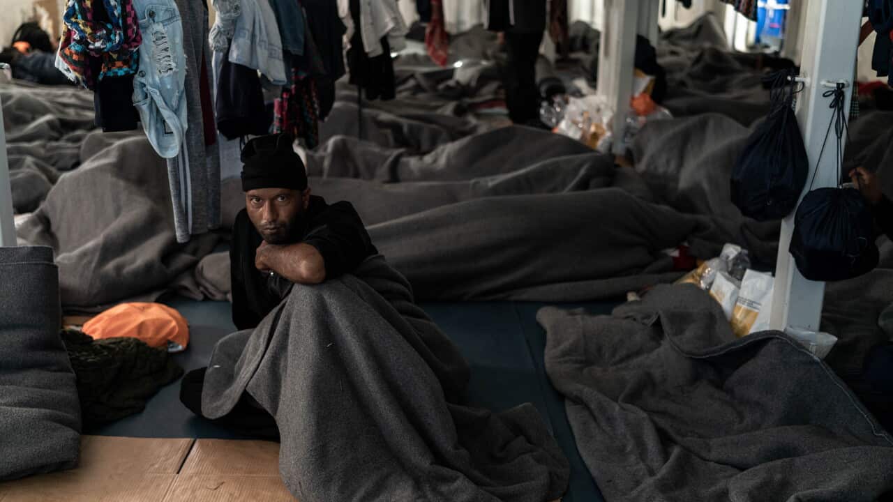 AT SEA - NOVEMBER 07: Survivors wake up after another cold night waiting for a safe harbor on the Ocean Viking on November 7, 2022 in the Gulf of Catania in the Mediterranean Sea.